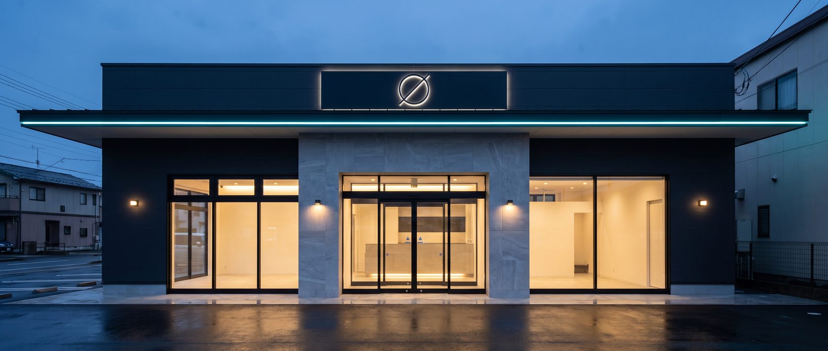 LEDのラインと光る看板がある夕暮れの店舗外観